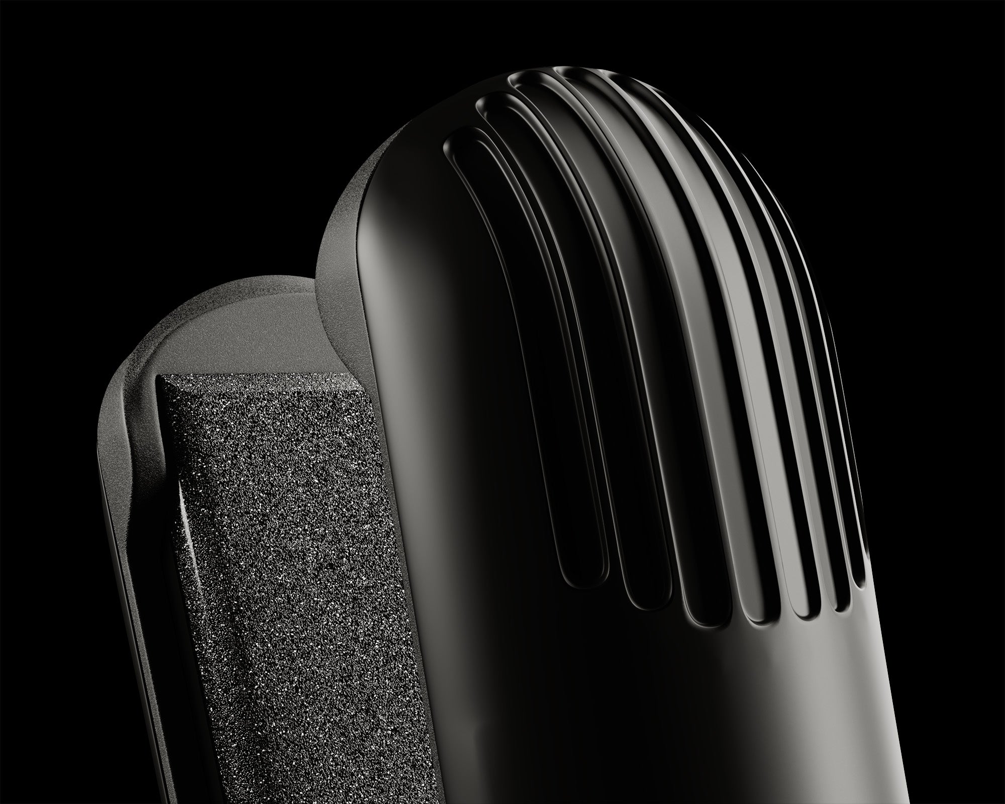 Close up of the top of the ceramic plates of the black Touch Iron on a black background.
