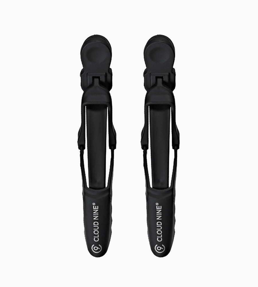 A zoomed out face on image of black CLOUD NINE Crocodile clips on white background.
